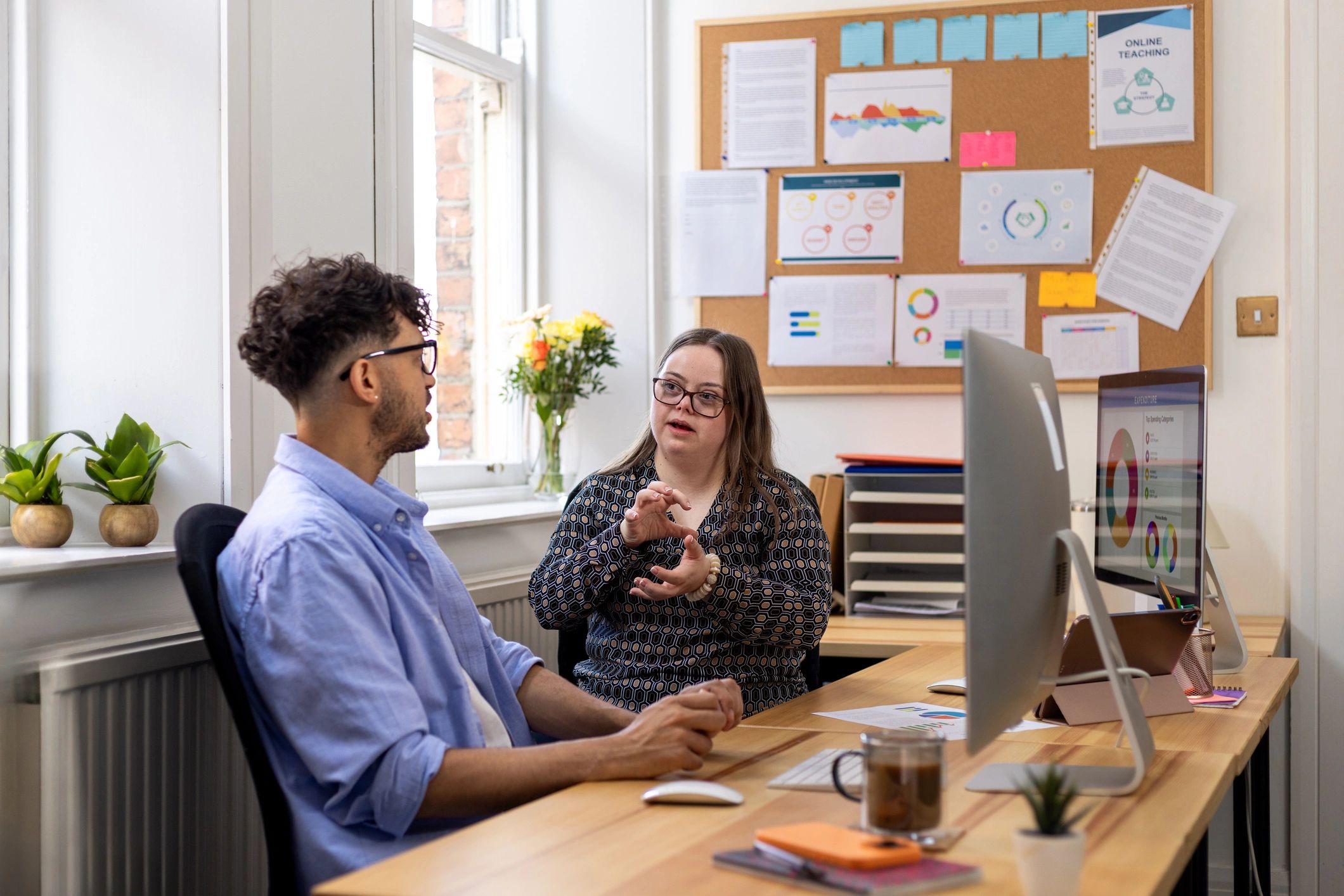 Case manager meeting with a resident in an office